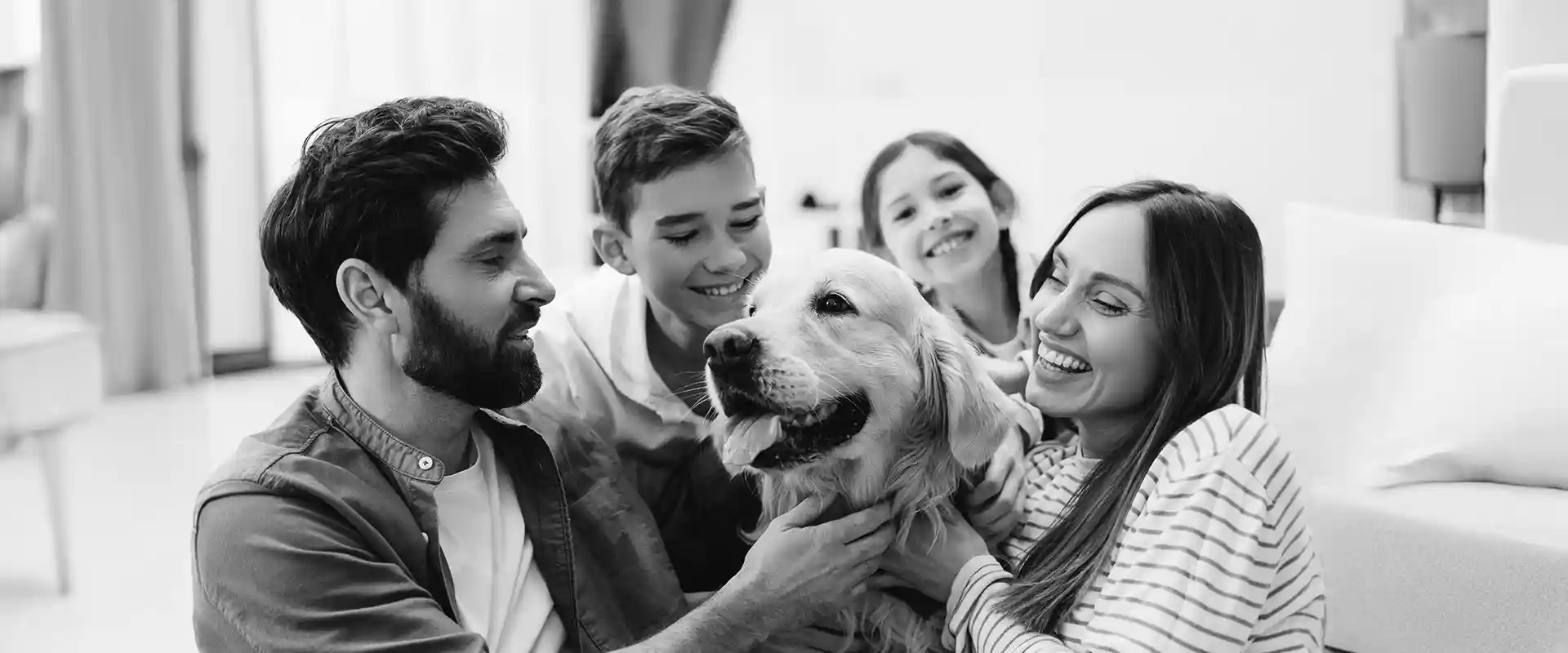 A family with their golden retriever